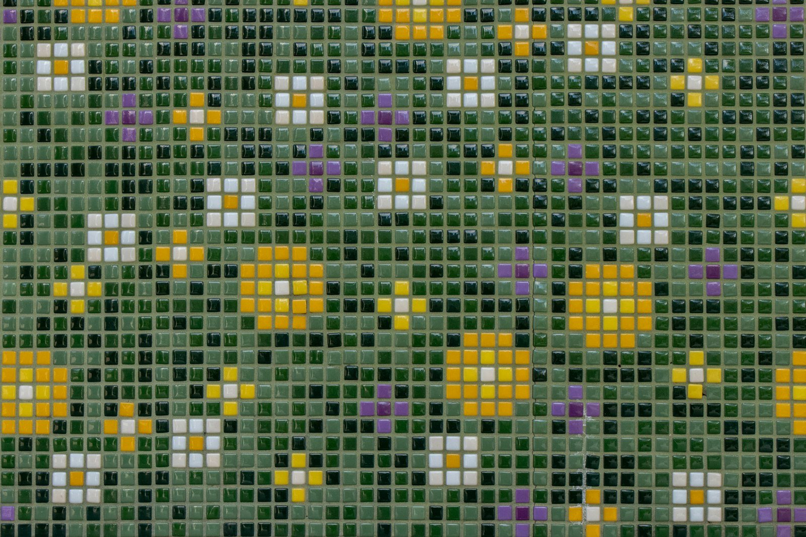 A mosaic of yellow and white flowers made from small tiles.