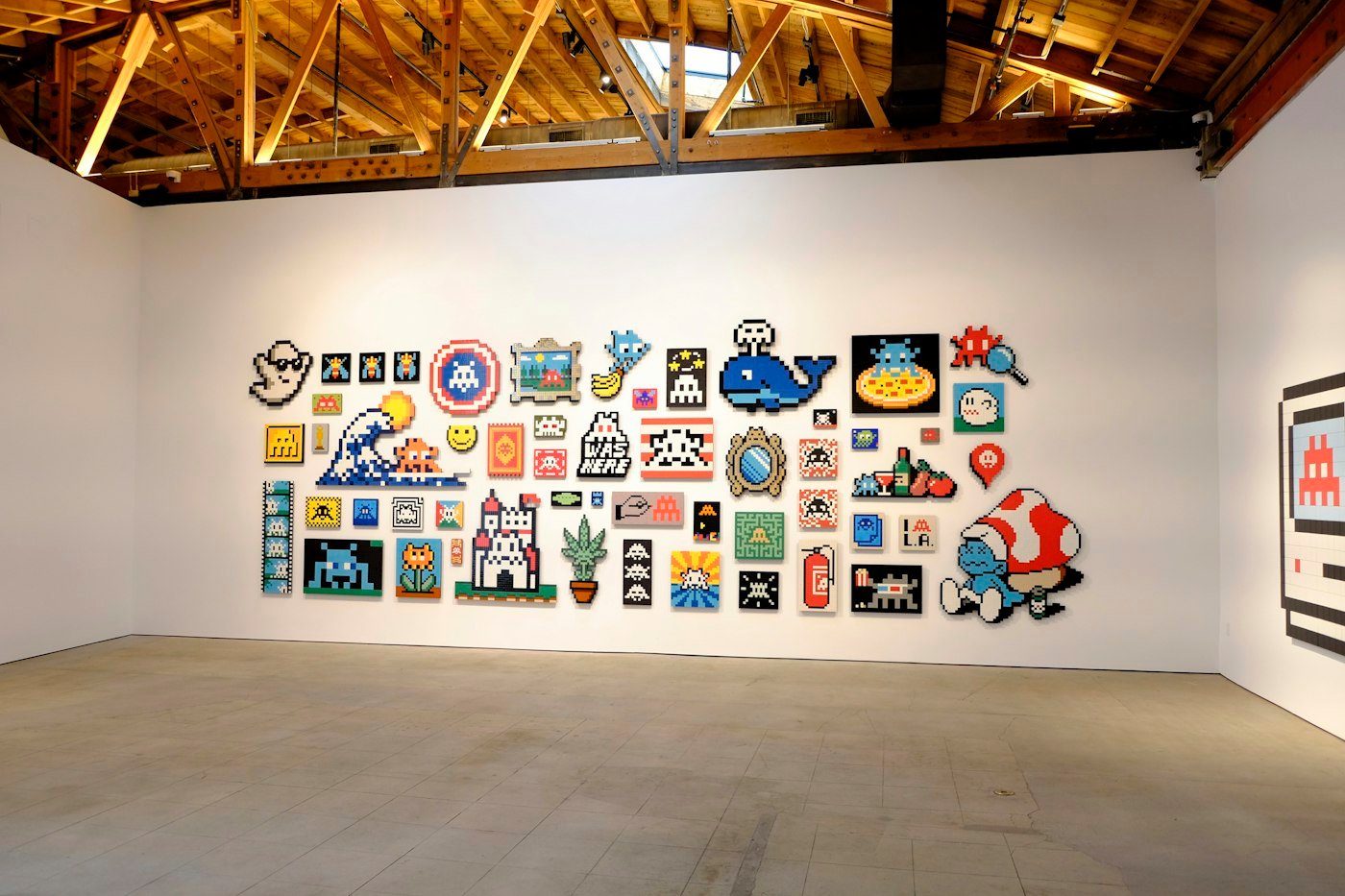 Main hall wall covered with pixel pictures.